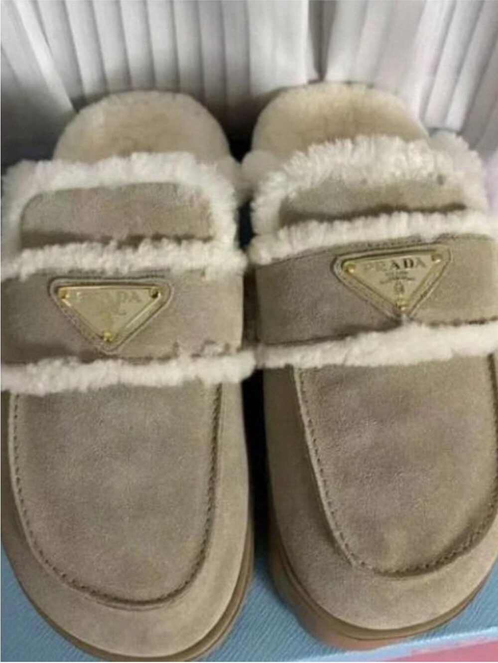 Prada Taupe Suede Shearling-Trim Slip-Ons with Gold Logo